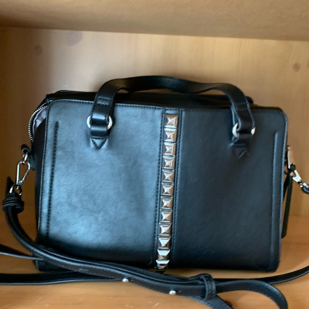 INC black pocketbook.
